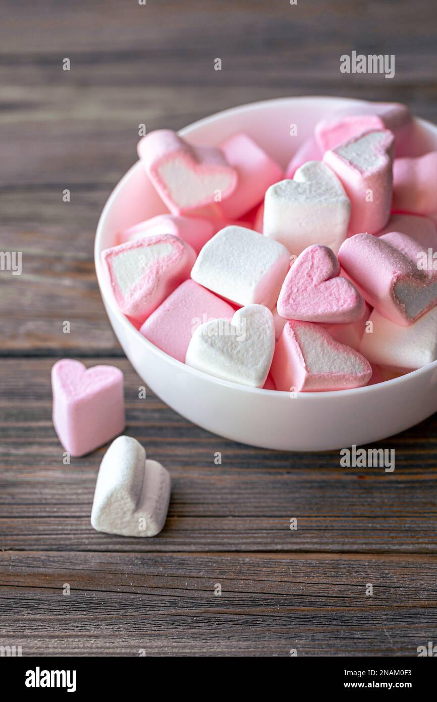 White And Pink Heart Shaped Marshmallows In A Porcelain Bowl Over Pink And  Blue Background High-Res Stock Photo - Getty Images
