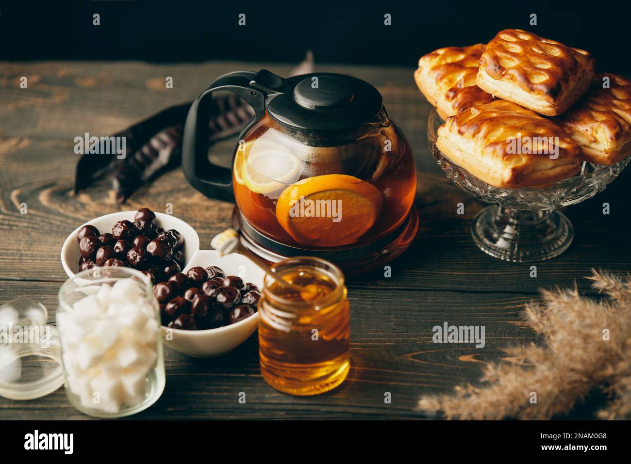 Homemade pastries on beautifully served table decorated in rustic style. Cozy home, tea time, food background Stock Photo