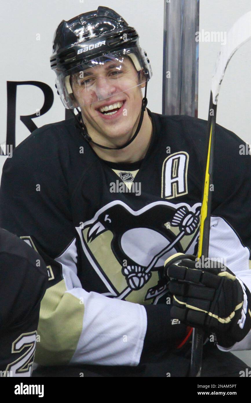 Pittsburgh Penguins' Evgeni Malkin (71) sits on the bench after scoring his  third goal of an NHL hockey game against the Buffalo Sabres in Pittsburgh  Saturday, Dec. 17, 2011. The Penguins won, image size:867x1390