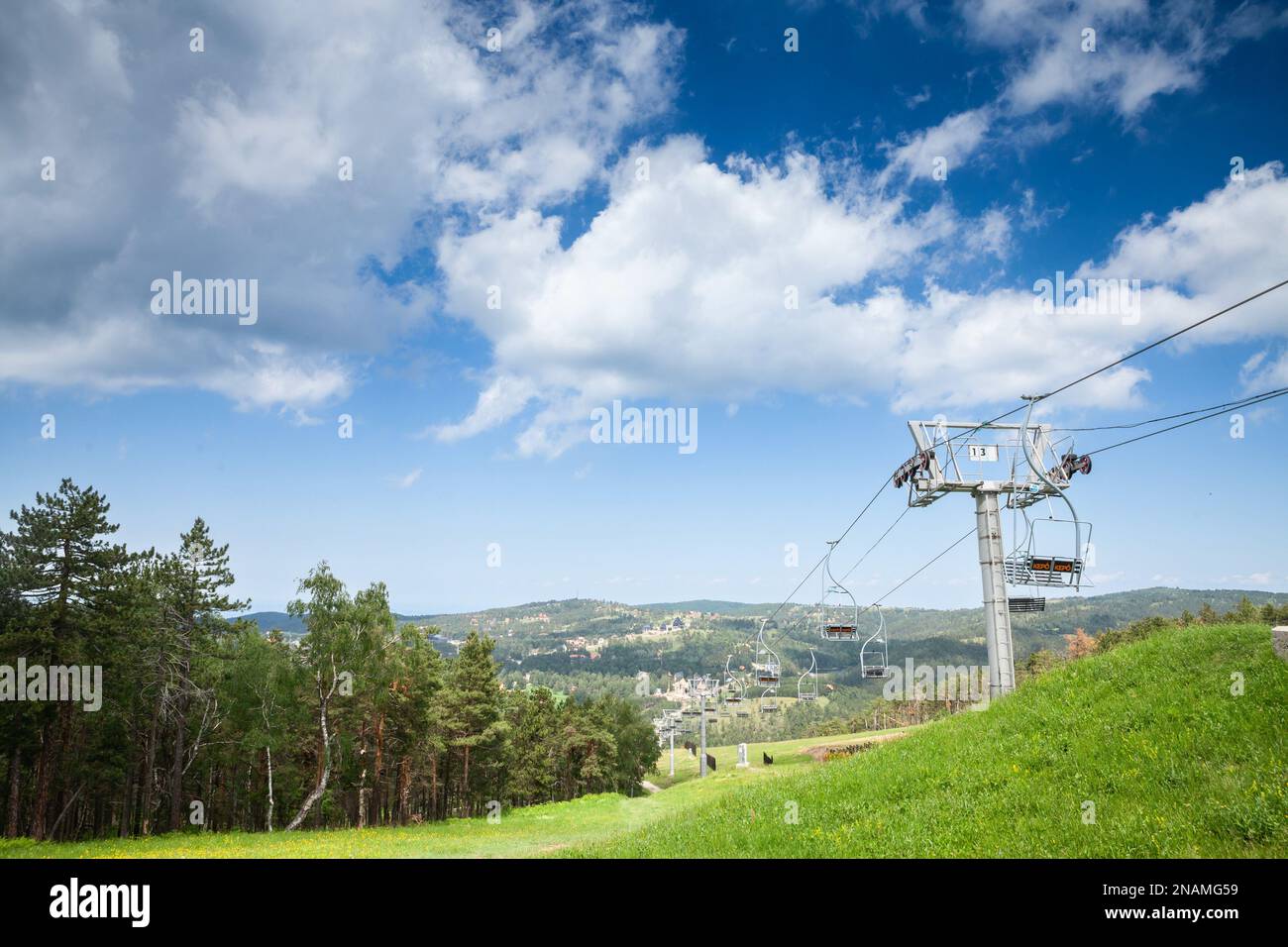 Picture of ski lifts stopped in summer in Divcibare in Serbia when there is no snow during the warm season. Divčibare is a town and mountain resort si Stock Photo