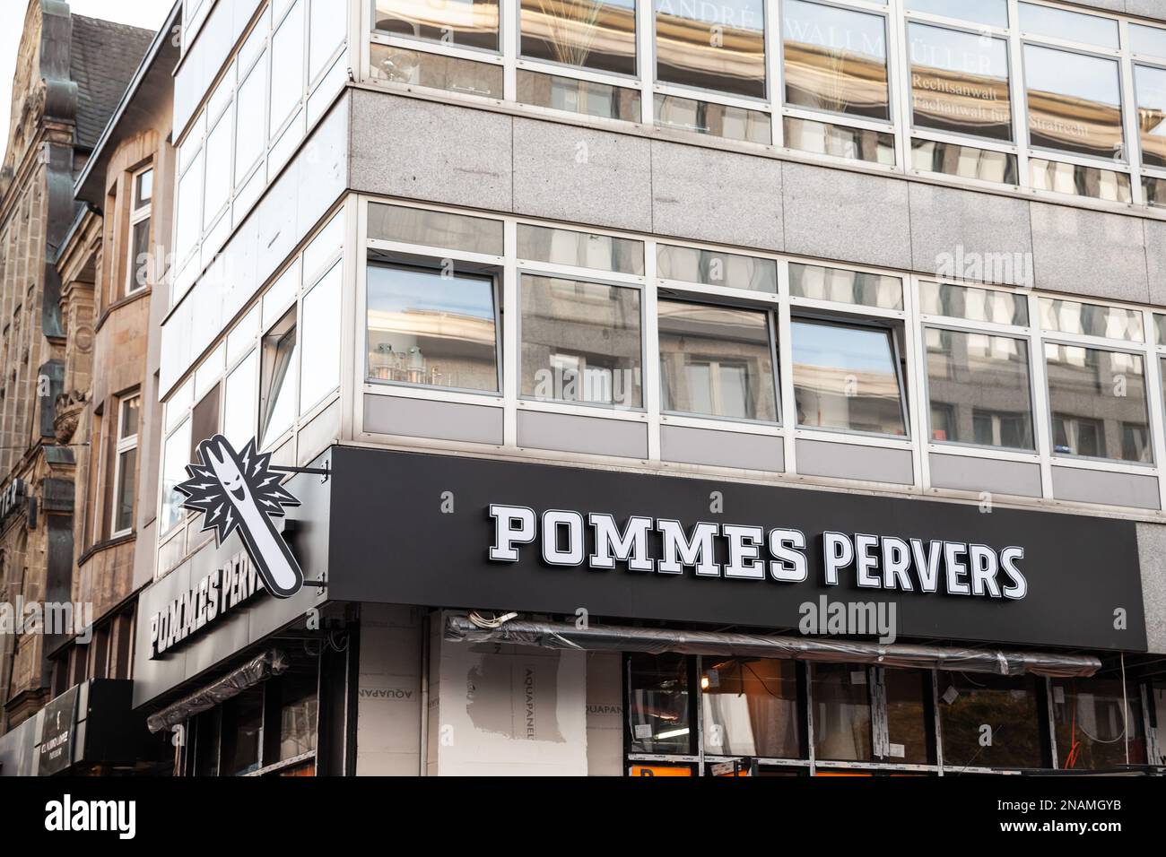 picture of a pommes pervers logo on their local restaurant in Essen, Germany. Pommes Pervers is a German fast food specialized in fries. Stock Photo