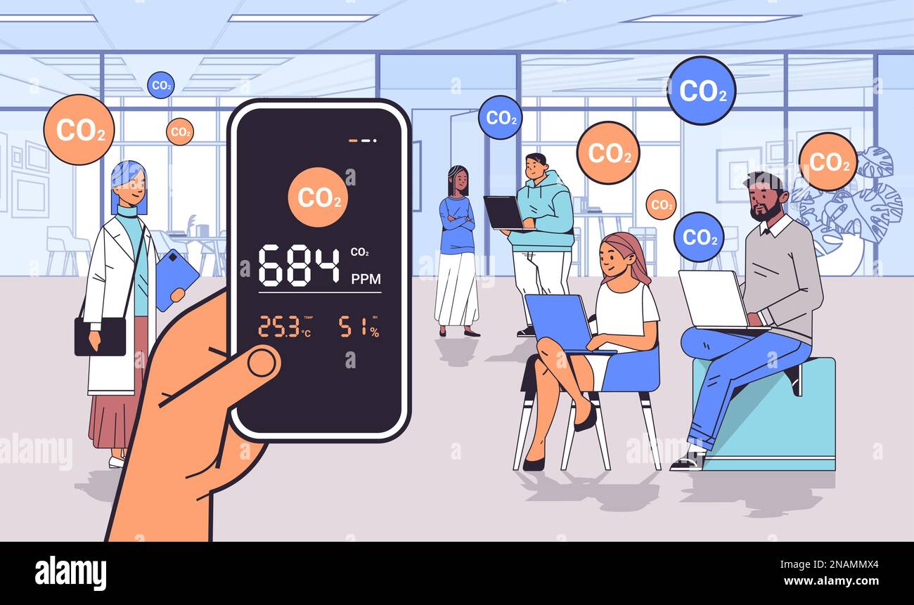 hand holding air quality monitor test on the presence of dangerous CO2