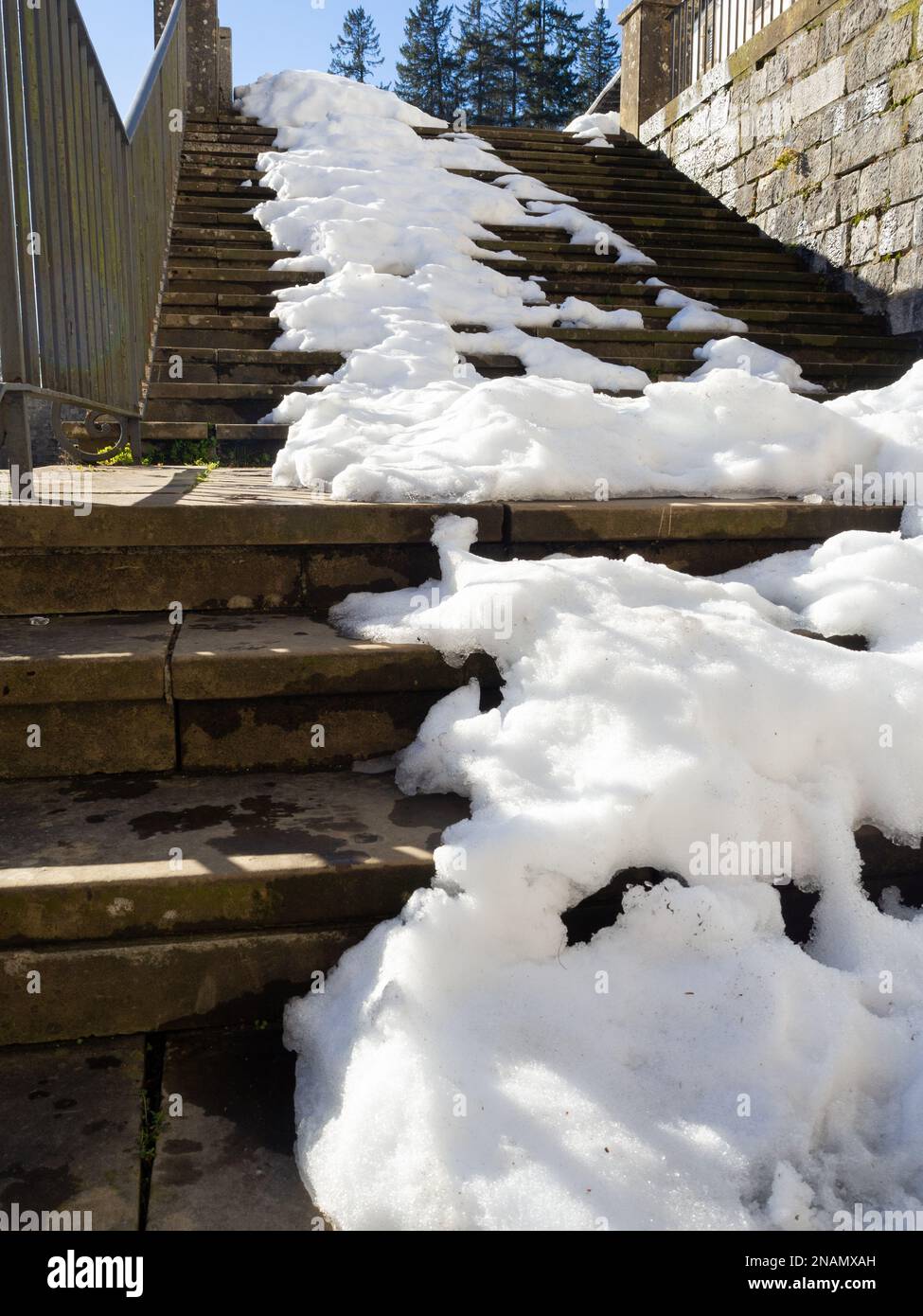 Snow storm stone stairs with snow Stock Photo