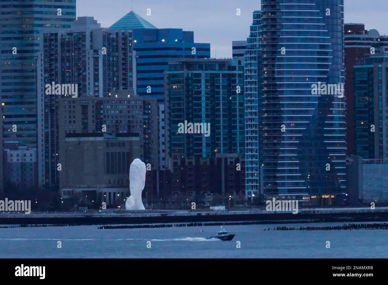 Sculpture in Jersey City skyline scene from the west side of Manhattan