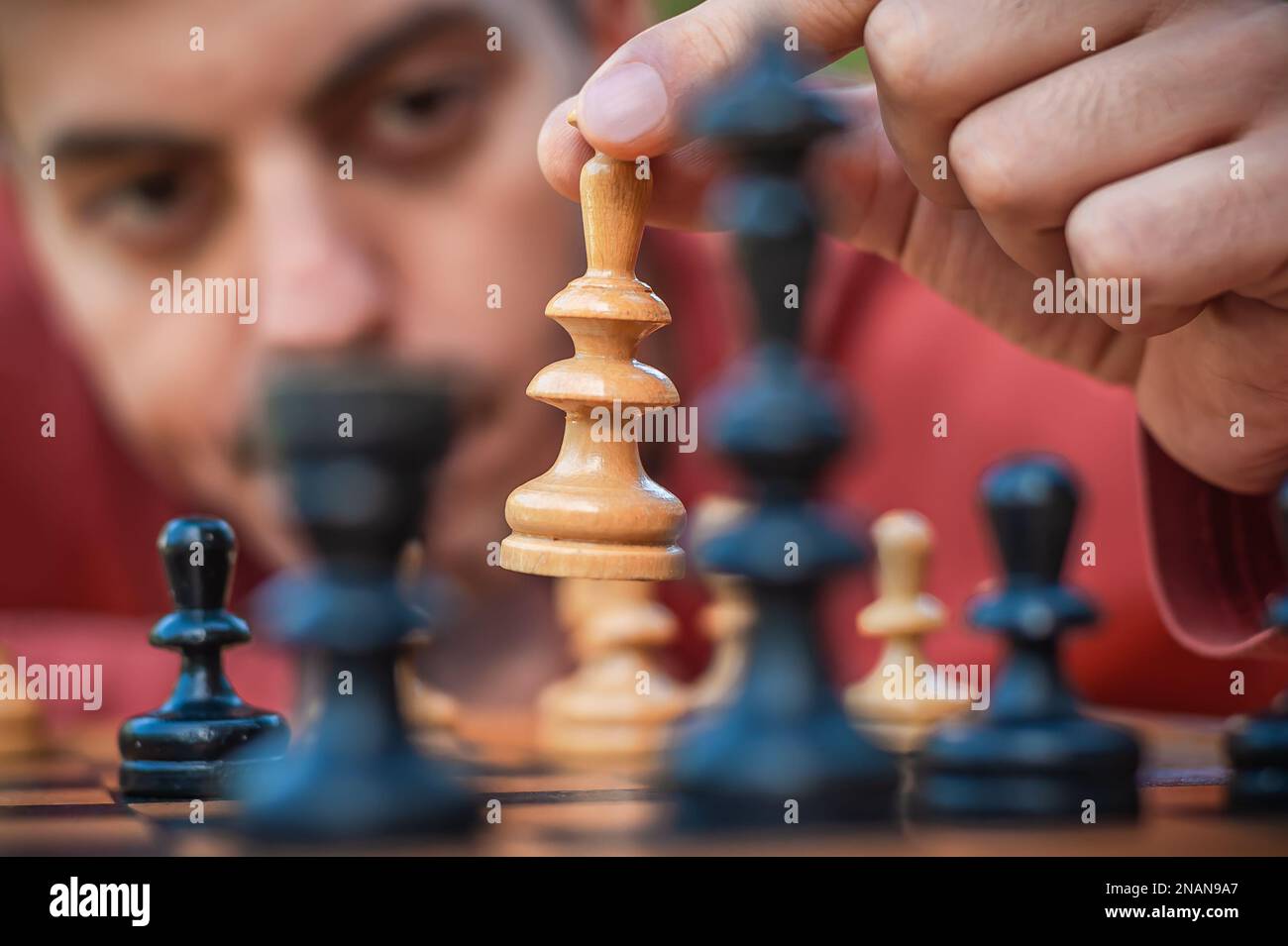 Handsome Male Model Considers His Next Chess Move Stock Photo