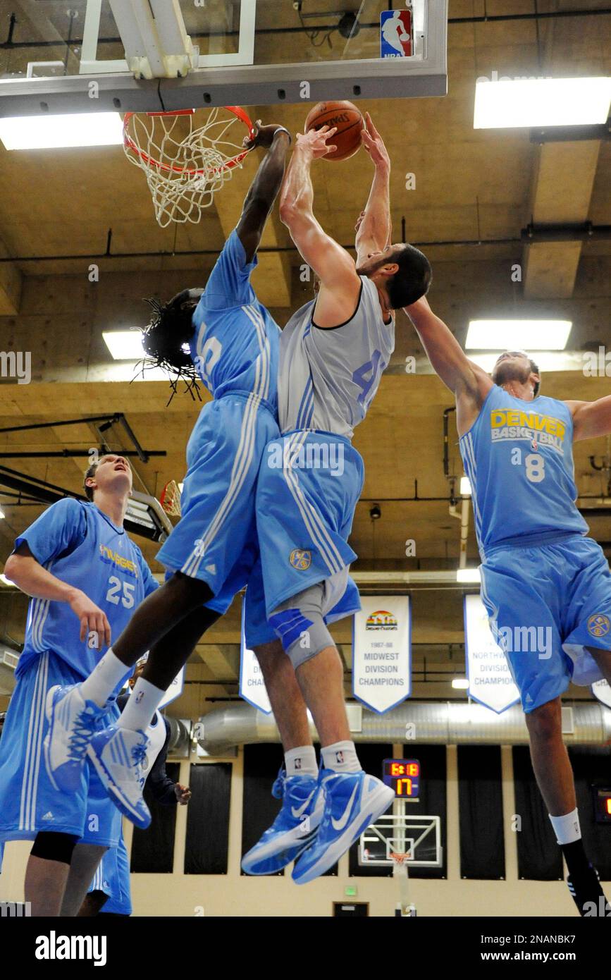 Denver Nuggets rookie forward Faried, left, knocks the ball