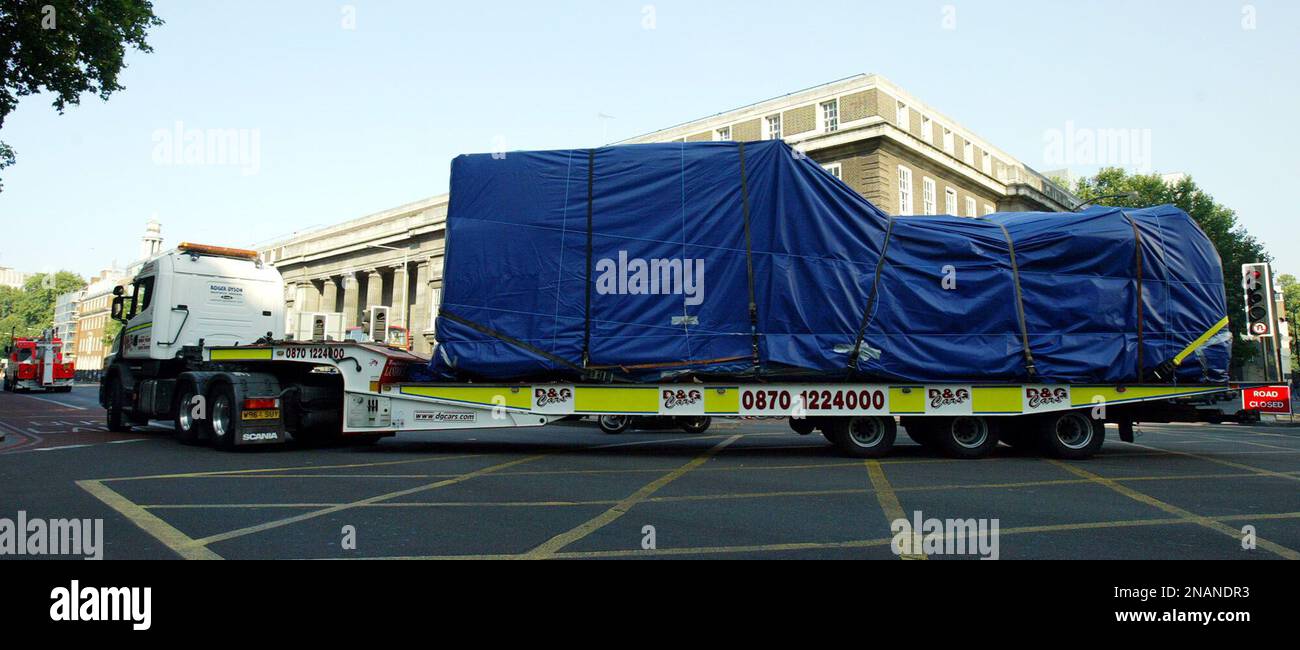 The bombed bus is moved from Tavistock Square in central London ...