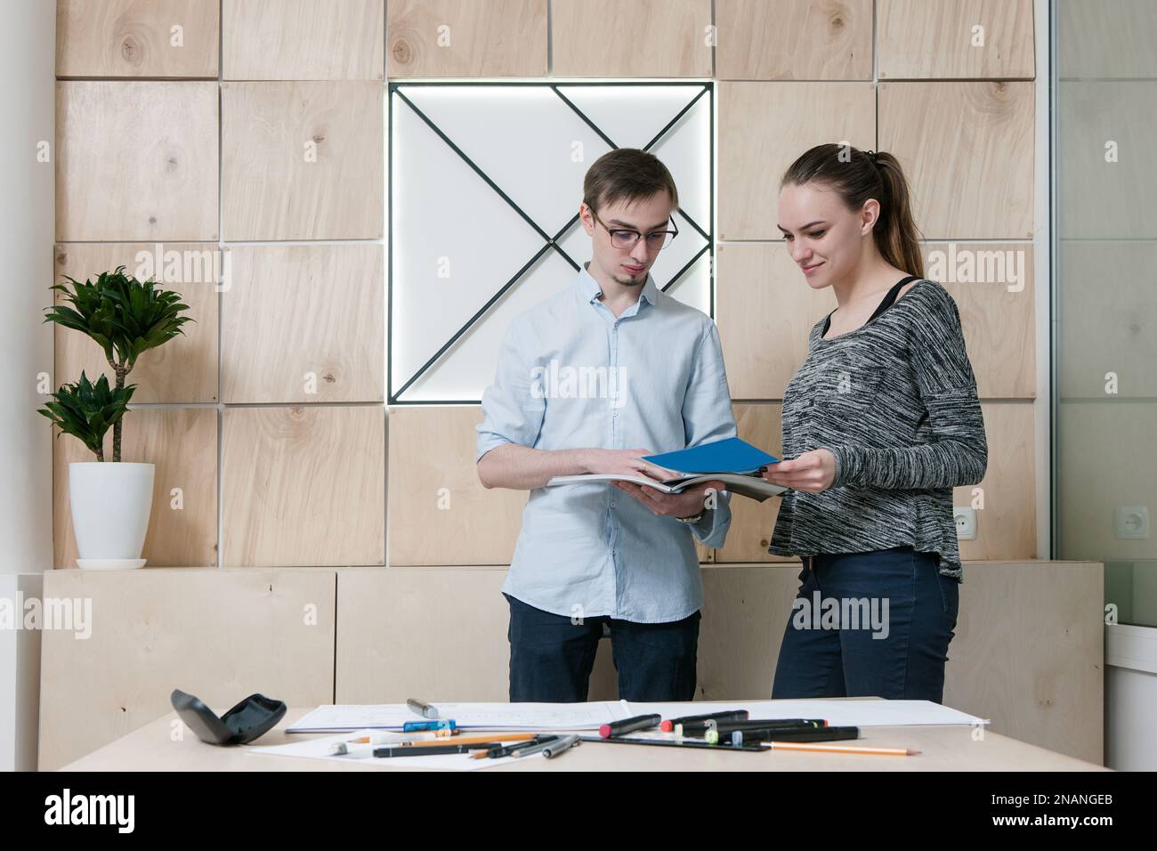 Designers discussing at office Stock Photo - Alamy