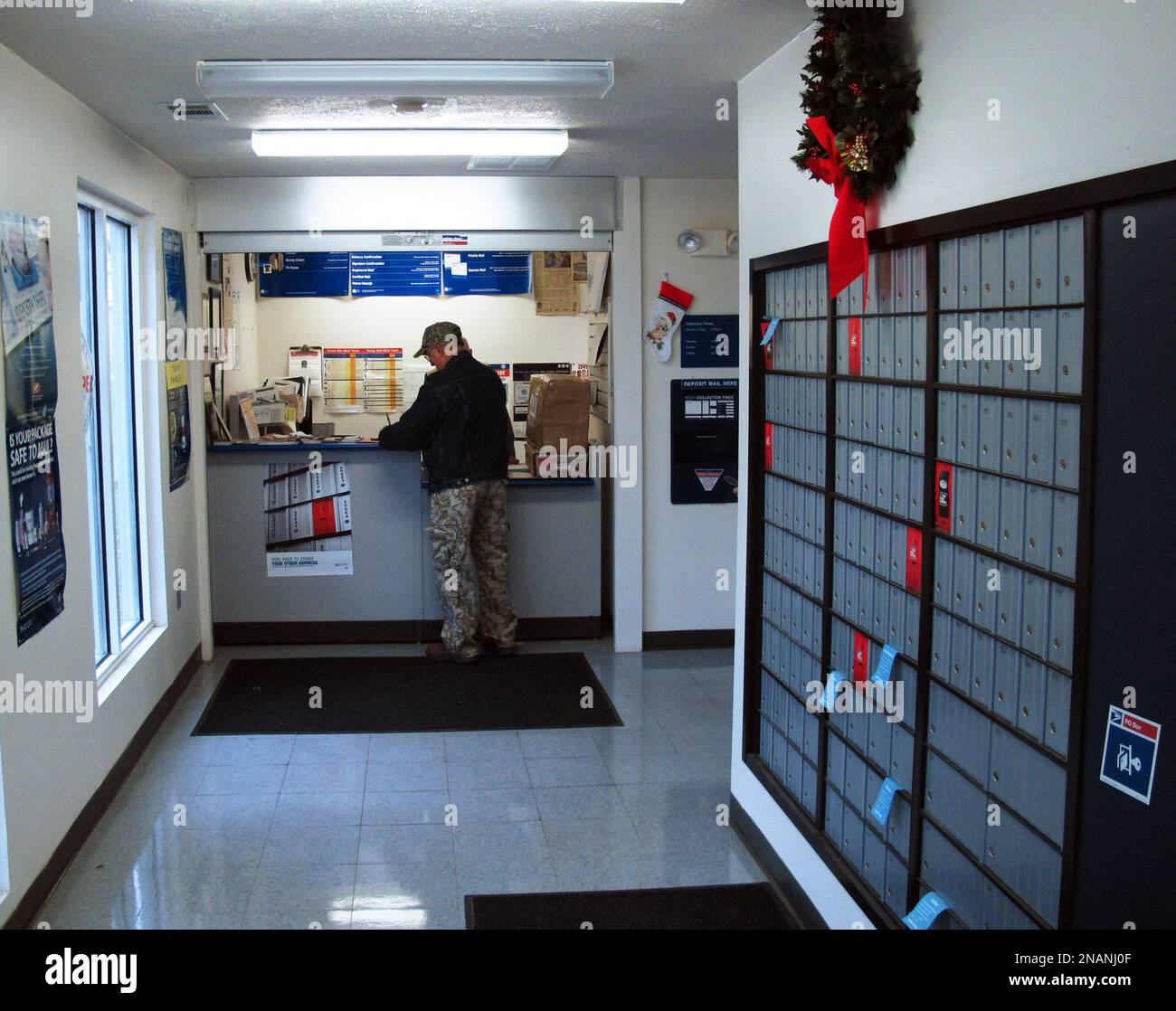 In this Dec. 6, 2011, photo Marvin Stoner stands at the window of the