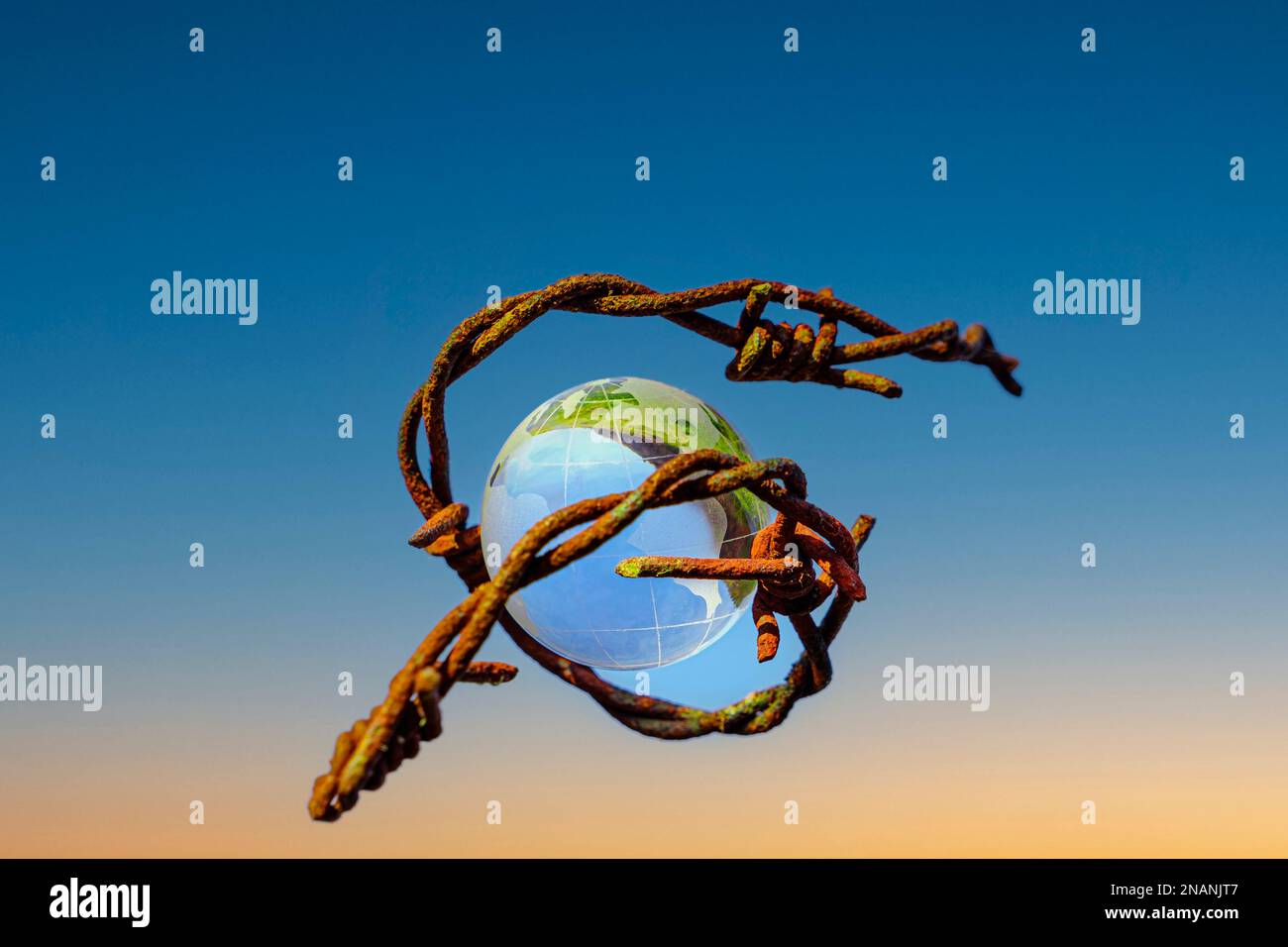 The concept of symbolism. On a blue sky is a glass globe, which is