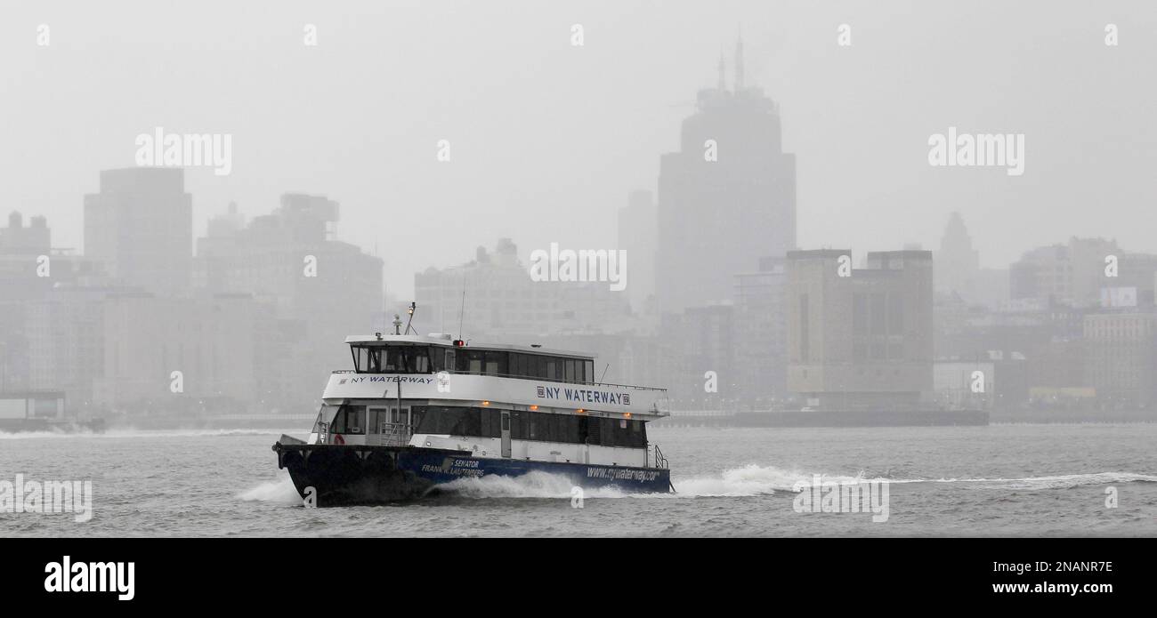 An NY Waterway ferry chugs along the Hudson River on its way to the