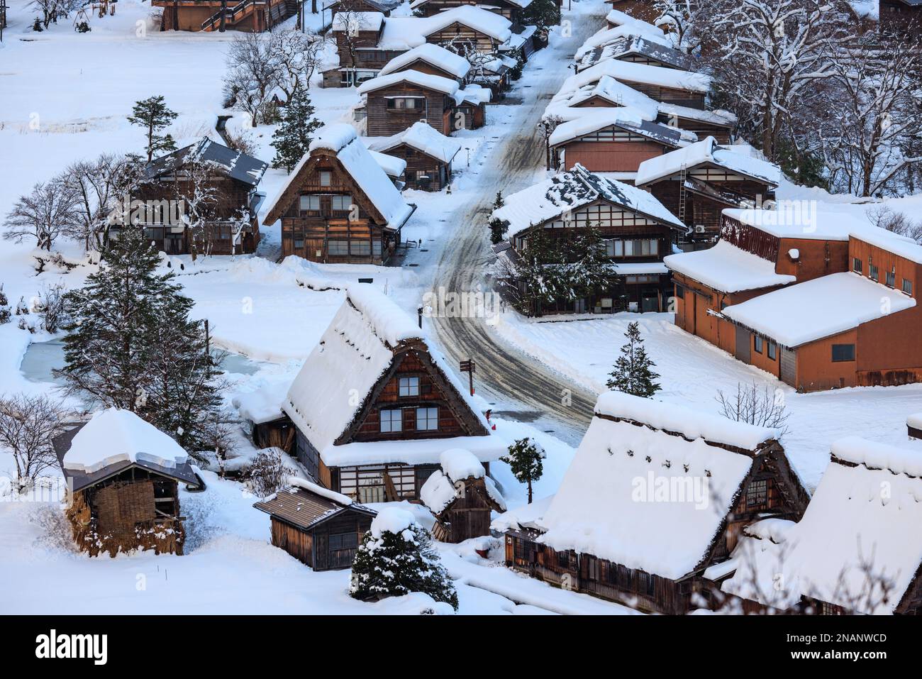 Snow covered A-frame roofs in historic Japanese mountain town in winter Stock Photo