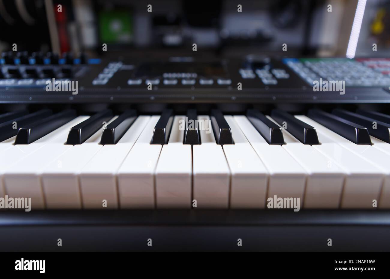 Synthesizer piano in music store. Buy modern synth device and compose