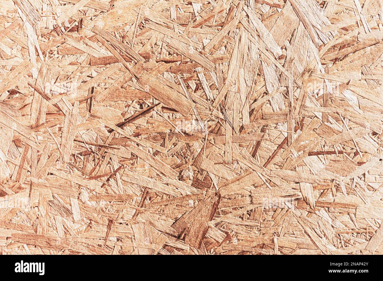the texture of plywood with fragments of pressed sawdust Stock Photo