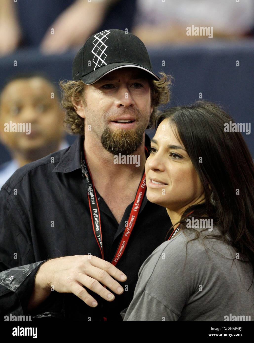 Former Houston Astros' Jeff Bagwell, left, and his girlfriend Rachel Brown,  right, in the second quarter of an NFL football game between the Houston  Texans and Atlanta Falcons Sunday, Dec. 4, 2011
