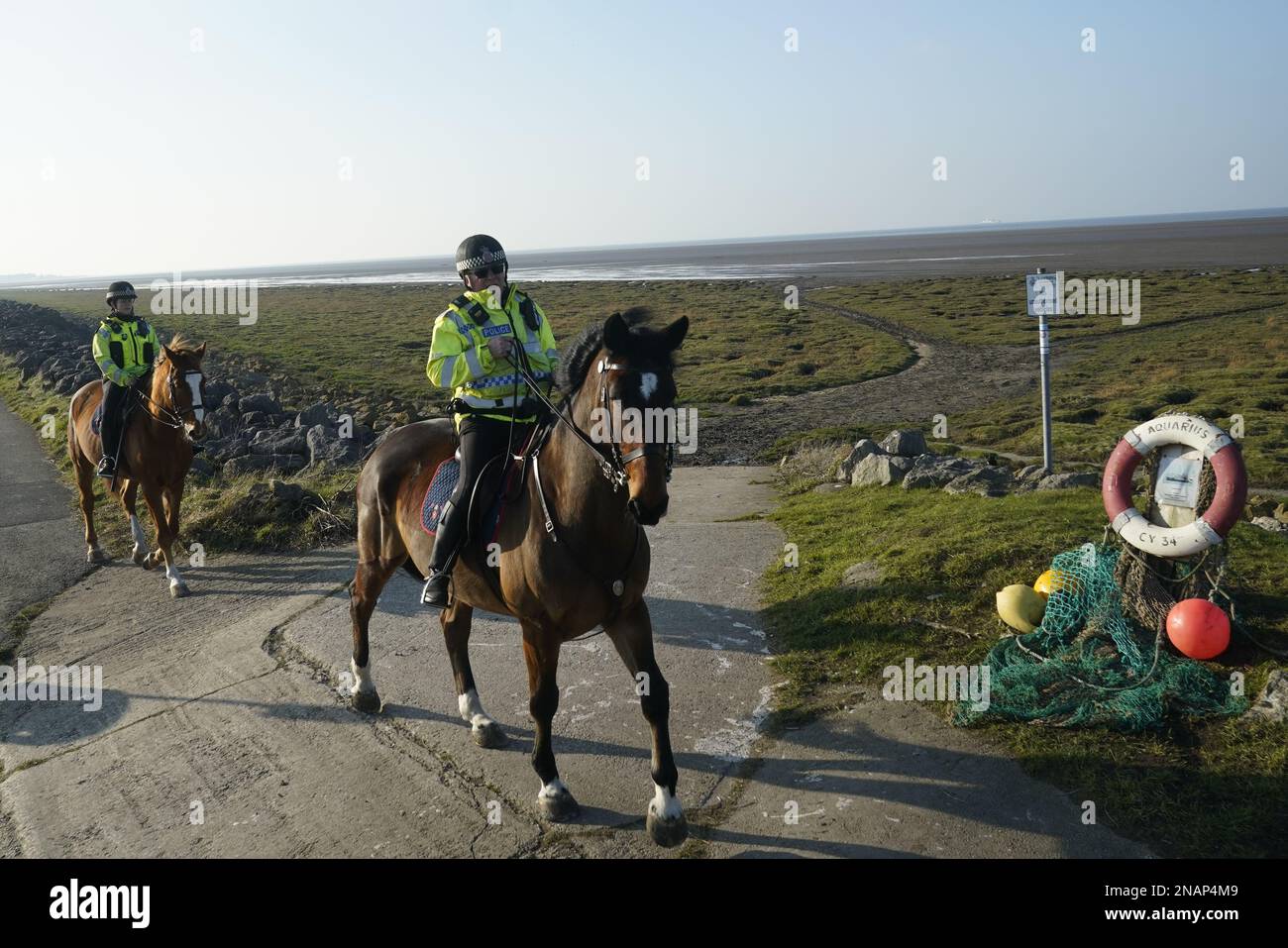 Mounted police in Knott End-on-Sea take part in the search for missing woman Nicola Bulley, 45, who vanished on January 27 in Wyre, Lancashire, while walking her springer spaniel Willow shortly after dropping her daughters, aged six and nine, at school. Picture date: Monday February 13, 2023. Stock Photo