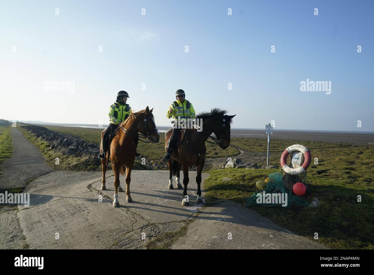 Mounted police in Knott End-on-Sea take part in the search for missing woman Nicola Bulley, 45, who vanished on January 27 in Wyre, Lancashire, while walking her springer spaniel Willow shortly after dropping her daughters, aged six and nine, at school. Picture date: Monday February 13, 2023. Stock Photo