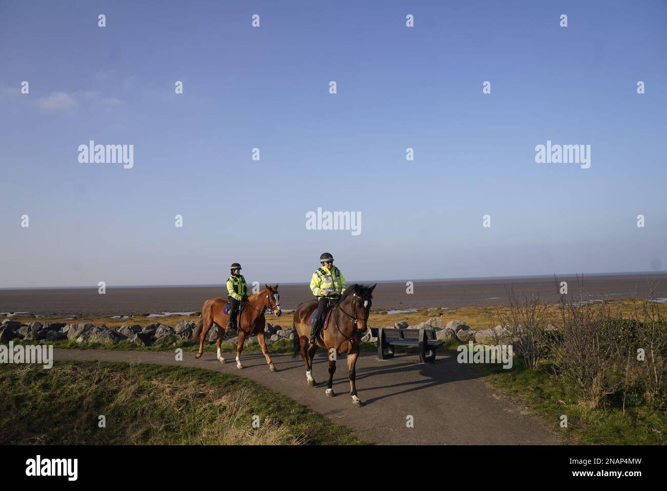 Mounted police in Knott End-on-Sea take part in the search for missing woman Nicola Bulley, 45, who vanished on January 27 in Wyre, Lancashire, while walking her springer spaniel Willow shortly after dropping her daughters, aged six and nine, at school. Picture date: Monday February 13, 2023. Stock Photo