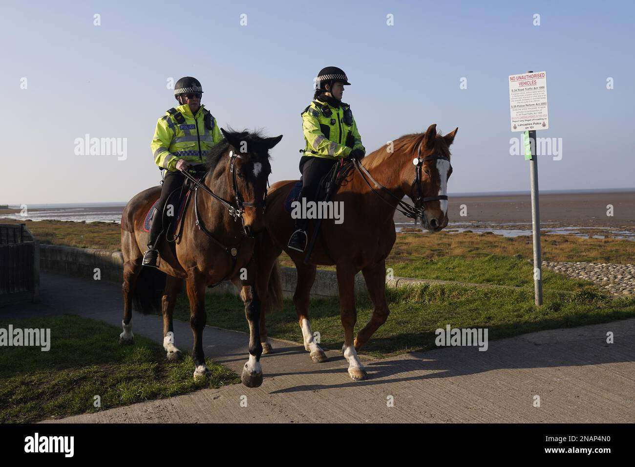 Mounted police in Knott End-on-Sea take part in the search for missing woman Nicola Bulley, 45, who vanished on January 27 in Wyre, Lancashire, while walking her springer spaniel Willow shortly after dropping her daughters, aged six and nine, at school. Picture date: Monday February 13, 2023. Stock Photo