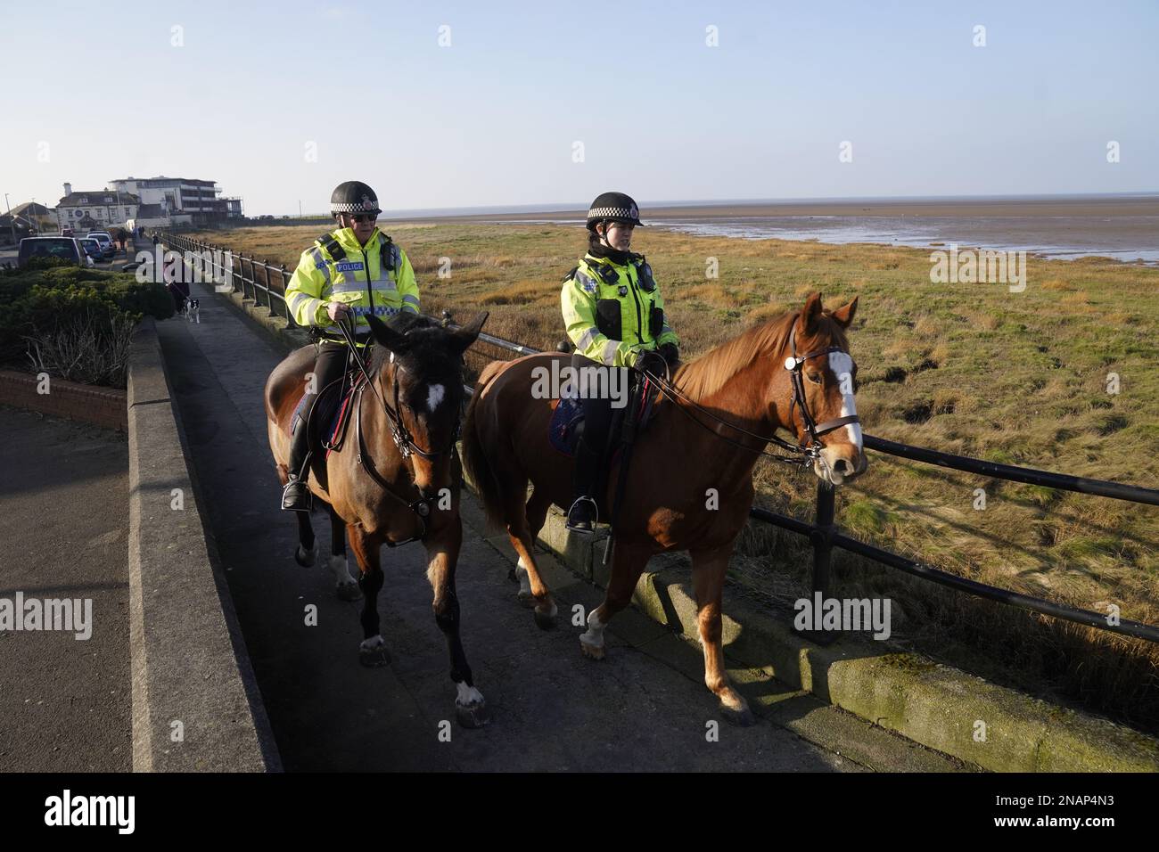 Mounted police in Knott End-on-Sea take part in the search for missing woman Nicola Bulley, 45, who vanished on January 27 in Wyre, Lancashire, while walking her springer spaniel Willow shortly after dropping her daughters, aged six and nine, at school. Picture date: Monday February 13, 2023. Stock Photo