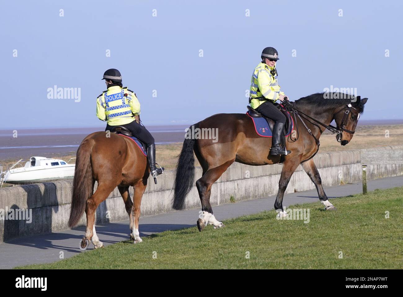 Mounted police in Knott End-on-Sea take part in the search for missing woman Nicola Bulley, 45, who vanished on January 27 in Wyre, Lancashire, while walking her springer spaniel Willow shortly after dropping her daughters, aged six and nine, at school. Picture date: Monday February 13, 2023. Stock Photo