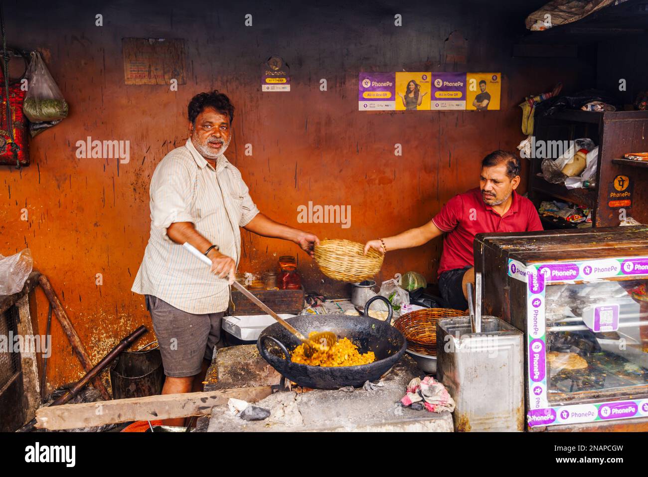 Street food being prepared and cooked in a roadside shop in Fariapukur, Shyam Bazar, a suburb of Kolkata, West Bengal, India Stock Photo