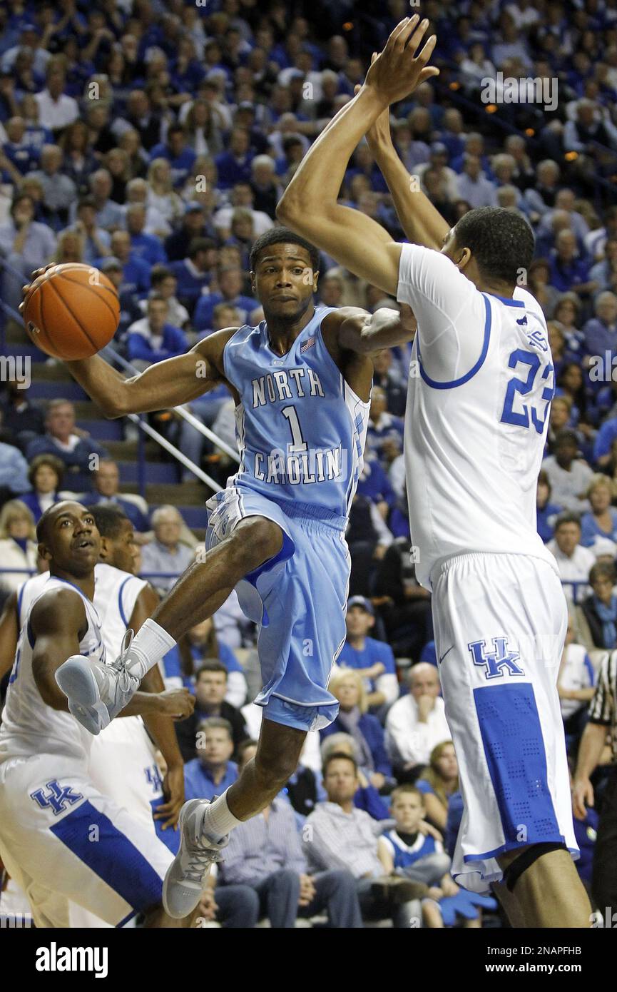 North Carolina's Dexter Strickland, left, looks for a teammate as
