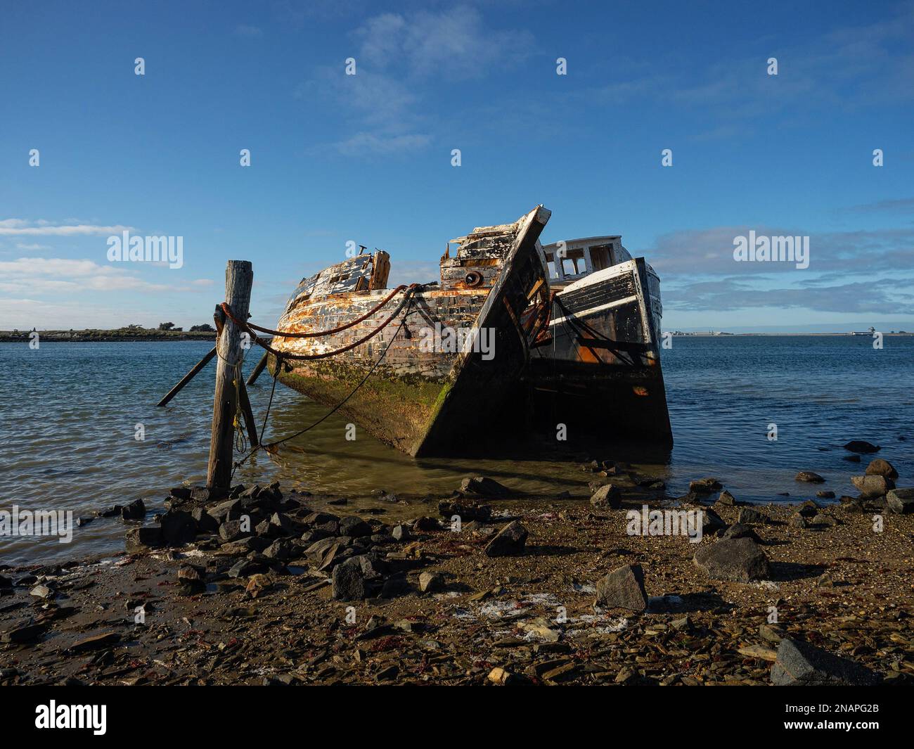 Remains ruins of old historical capsized tilted fishing boat ship wreck