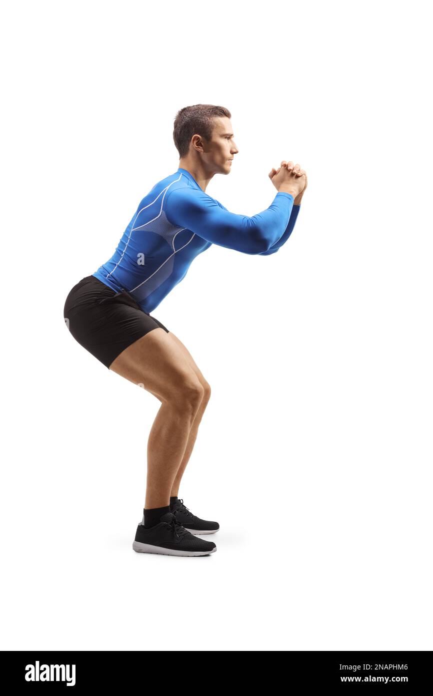 Full length profile shot of a muscular male athlete exercising isolated on white background Stock Photo