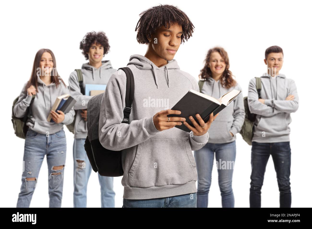 African american male student reading a book and group of caucasian ...