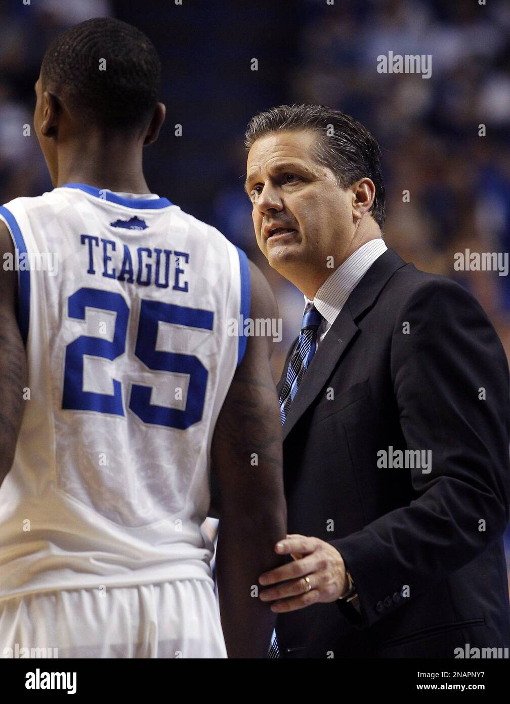 Kentucky head coach John Calipari, right, instructs Marquis Teague