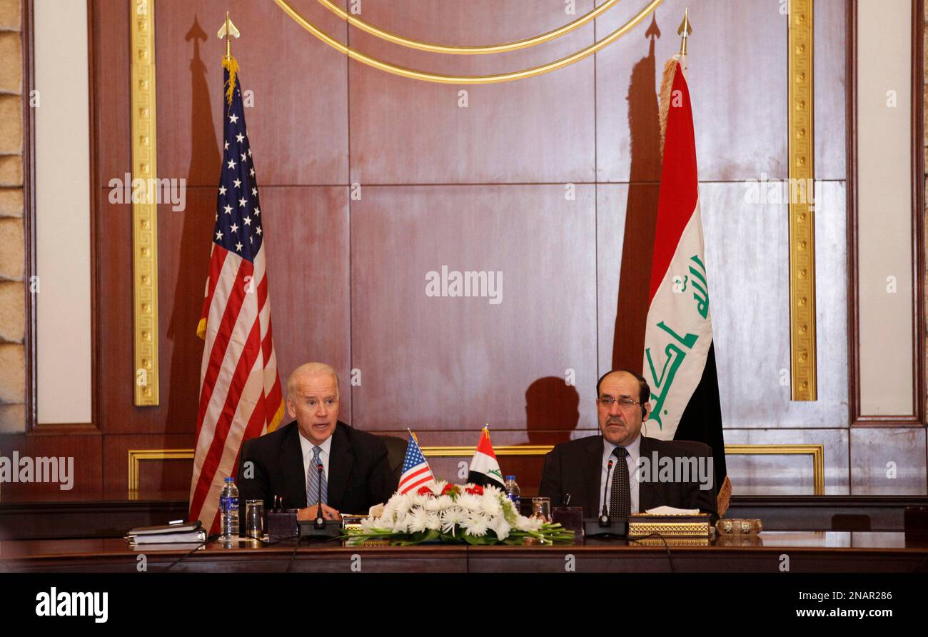 U.S. Vice President Joseph Biden, left, and Iraqi Prime Minister Nouri al-Maliki, right, hold a joint news conference in Baghdad, Iraq, Wednesday, Nov. 30, 2011. Biden said Wednesday that his trip to Baghdad ahead of the U.S. military pullout will mark a new beginning between Iraq and the United States, but already protests in Iraq against his visit are demonstrating the difficulties the relationship will face. (AP Photo/ Khalid Mohammed) Stock Photo