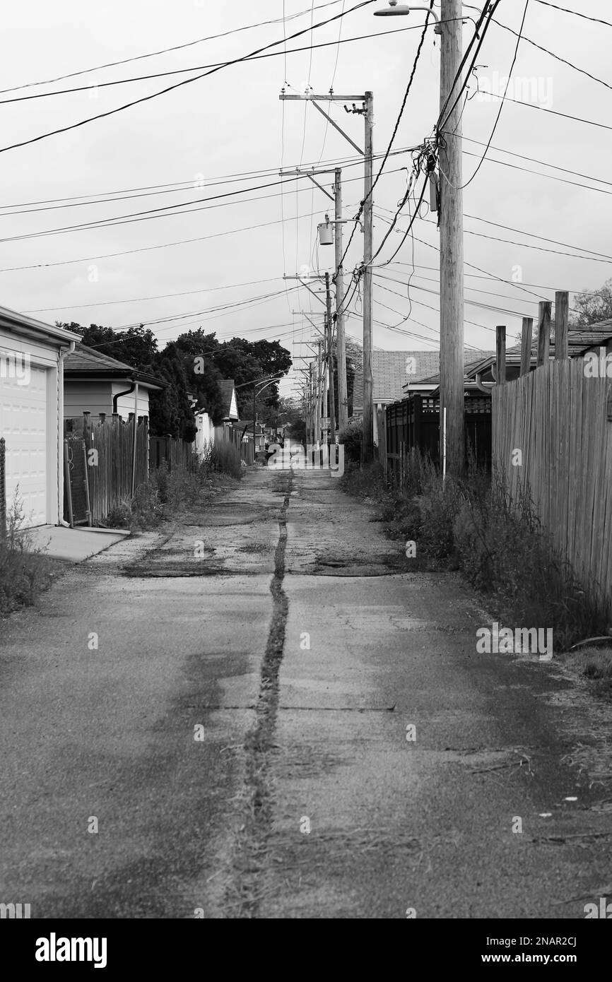 Typical common back alley of an urban residential street in a black and