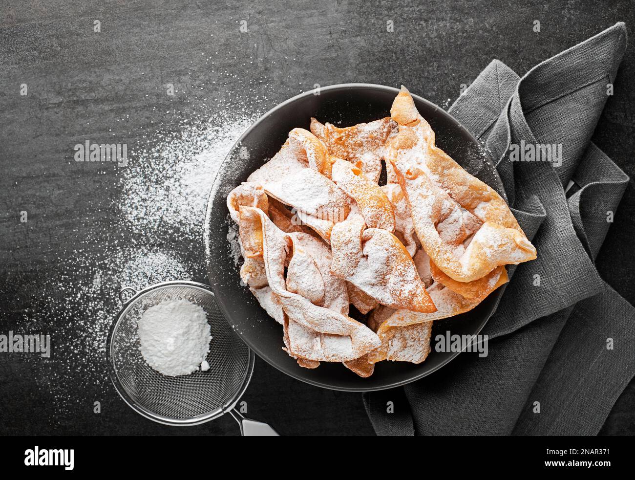 Traditional sweet crisp pastry faworki or angel wings, deepfried and