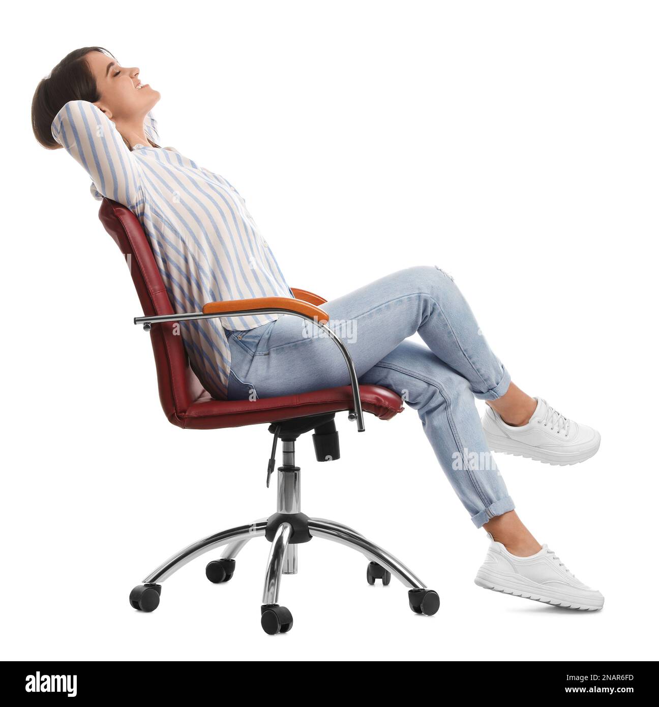 Young woman relaxing in comfortable office chair on white background Stock Photo