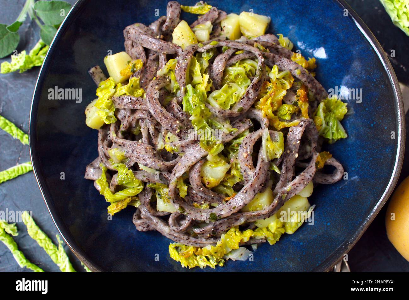 Homemade buckwheat pasta Pizzoccheri with cabbage and potatos. Top view