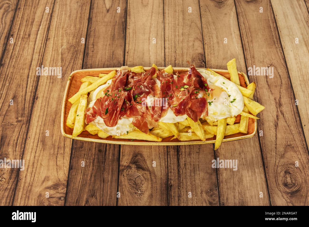 A wonderful Spanish tapa plate of scrambled eggs with serrano ham on a