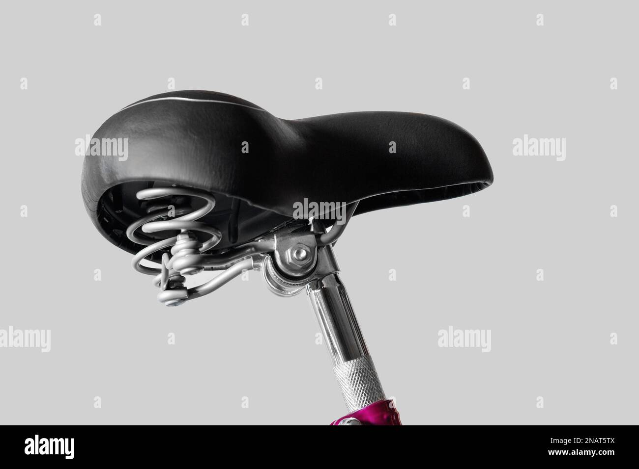 Bicycle saddle wide. Seat post. Close-up. Isolated on light gray background. Stock Photo