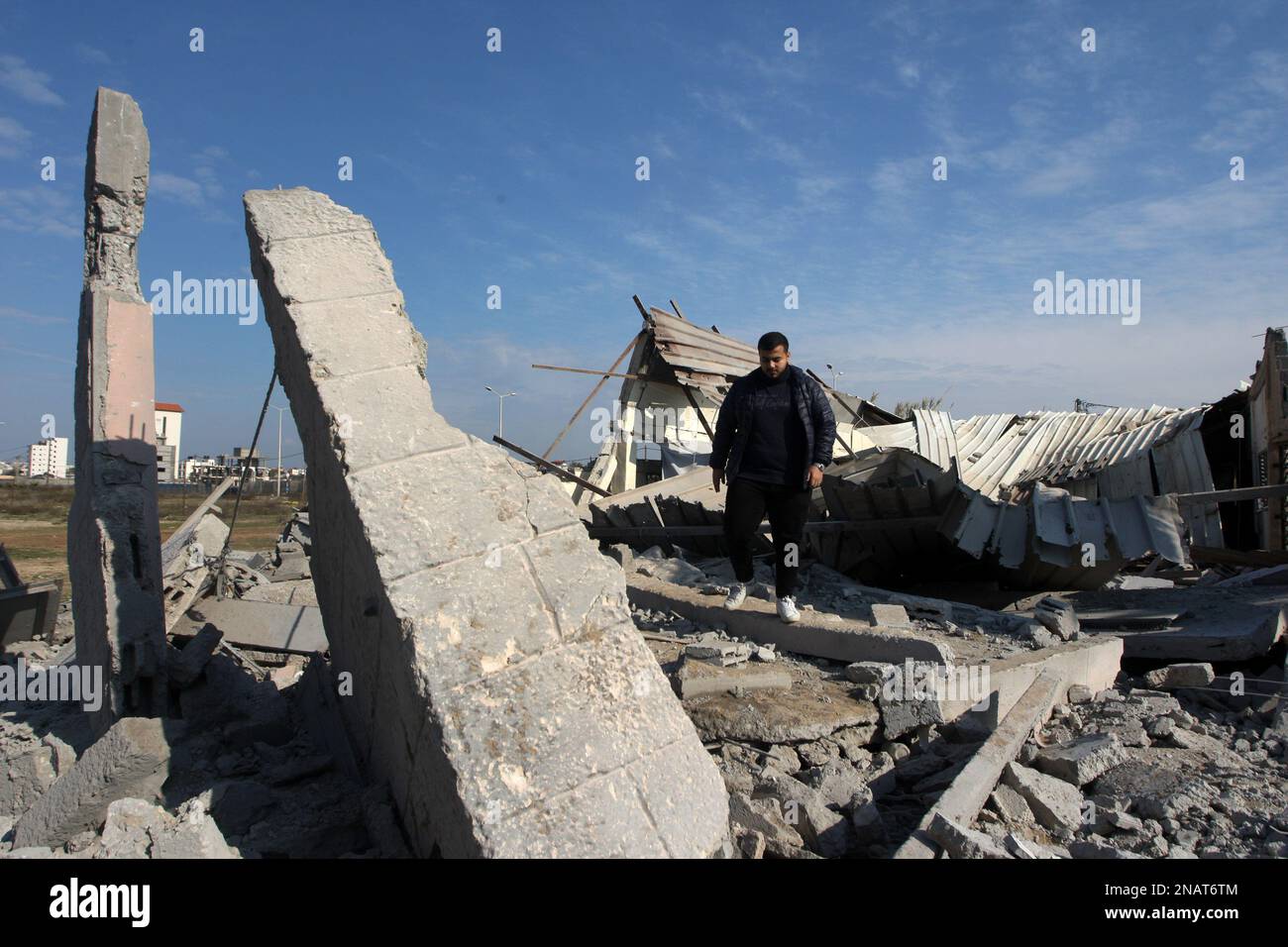 Palestinians inspect a destroyed wedding hall following Israeli strikes in Gaza City, early, on Monday on February 13, 2023. Israel hit Gaza with air strikes, the army said, as unrest persisted in the occupied West Bank. Photo by Ismael Mohamad/UPI Credit: UPI/Alamy Live News Stock Photo