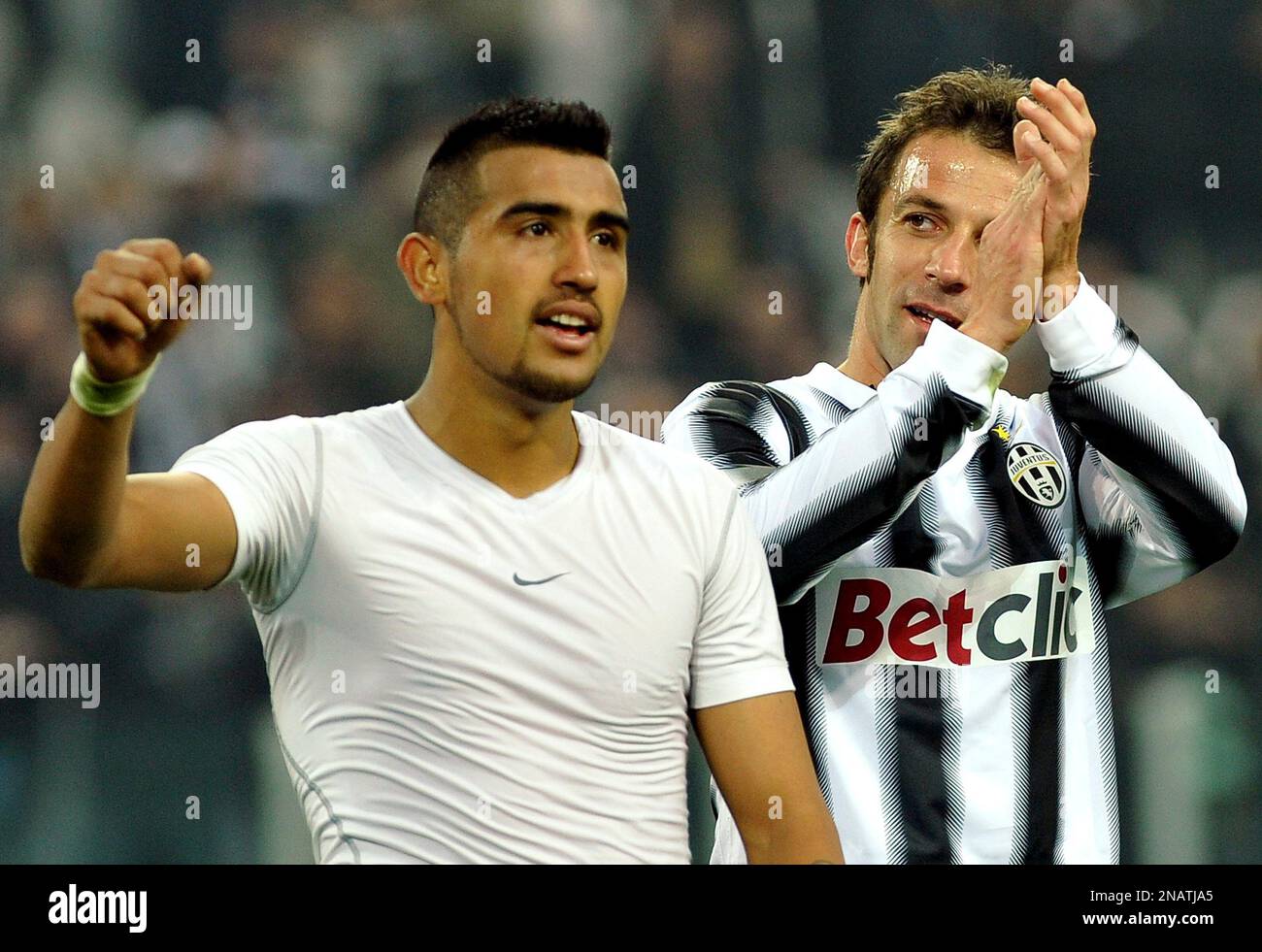 Juventus' Alessandro Del Piero, right, and Arturo Vidal, from Chile,  celebrate their 3-0 win over Palermo, at the end of a Serie A soccer match  at the Juventus stadium in Turin, Italy,, image size:1300x981