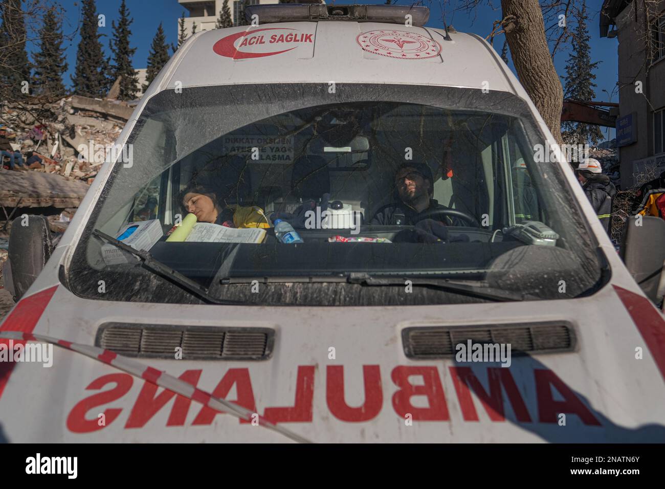 Kahramanmaras, Turkey. 13th Feb, 2023. Paramedics on duty in an ambulance at the earthquake area fall asleep from exhaustion. Turkey and Syria have experienced the worst earthquakes to strike the region in almost a century. A 7.8-magnitude quake struck southeastern Turkey, which was followed by a second quake of 7.7 in northern Syria . More than 30,000 people are reported to have died as a result of the quakes and the death toll is still rising. Credit: SOPA Images Limited/Alamy Live News Stock Photo
