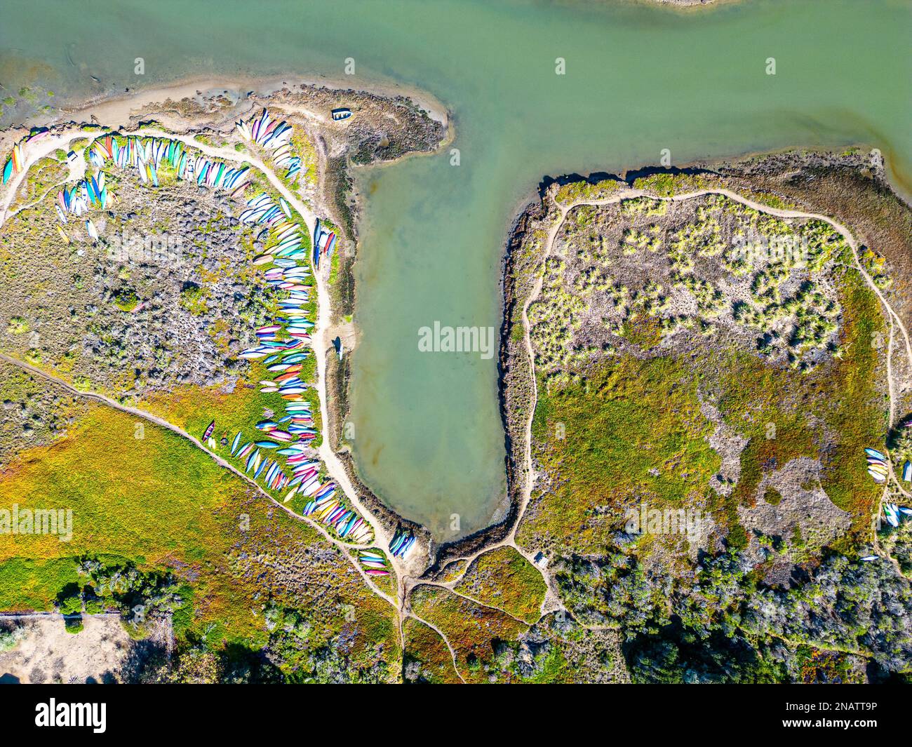 Aerial shot of bay with kayak, boats, sup and canoe. Birdview shot. California Stock Photo