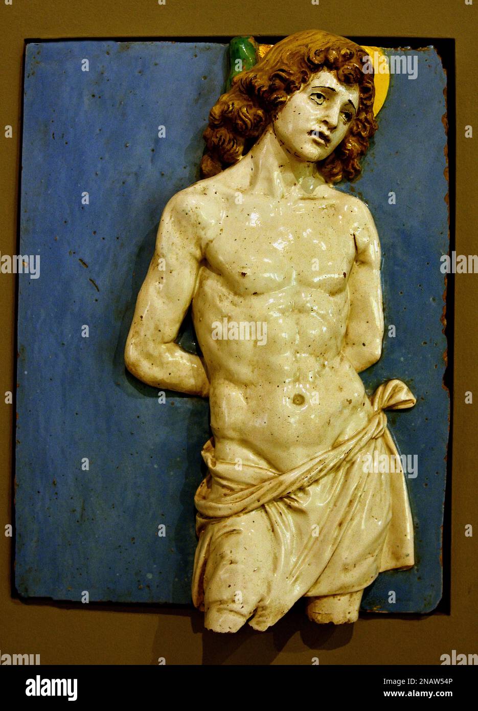 San Sebastiano - Saint Sebastian  1450 15th Century by workshop  Andrea della Robbia, Fine Art Museum, Italy, Italian, Saint, Sebastian, (died c. 268 AD),  Christian saint and martyr,  Killed during the Roman, Emperor, Diocletian, persecution of Christians, He criticized the emperor, clubbed to death ) Stock Photo