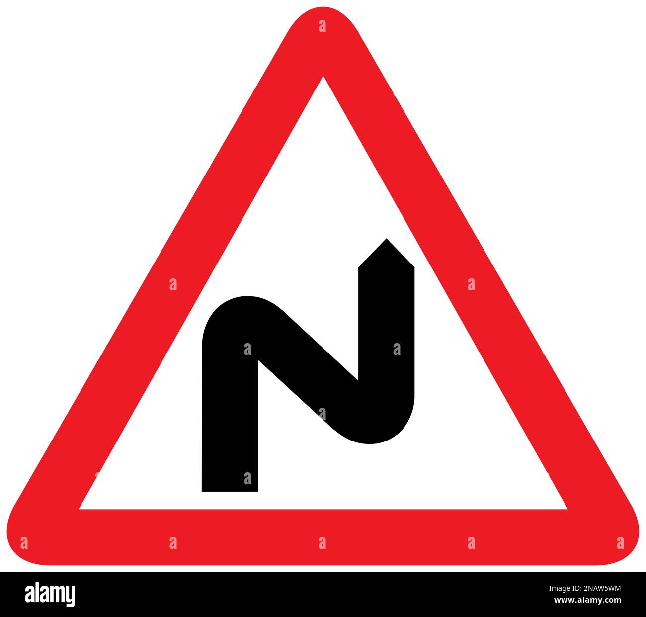 Double bend first to the right British road sign Stock Photo