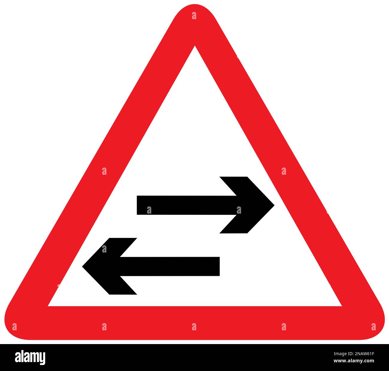 Two-way traffic on route crossing ahead British road sign Stock Photo