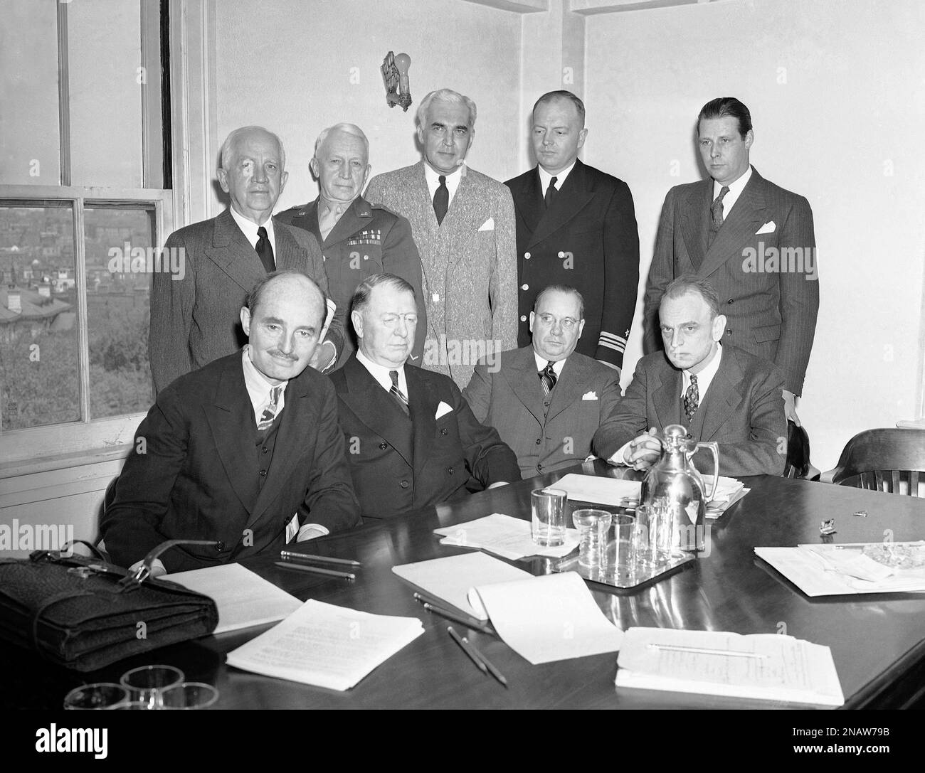 James M. Landis (seated right) called his civilian defense