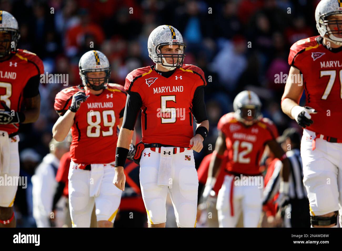 Maryland quarterback Danny O'Brien (5) walks onto the field with his ...