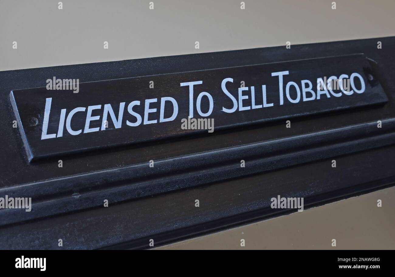 sign above the door, Licensed To Sell Tobacco - cigarettes, cigars,, shag, pipes etc - "CONTOB" ("confectionery and tobacco") Stock Photo