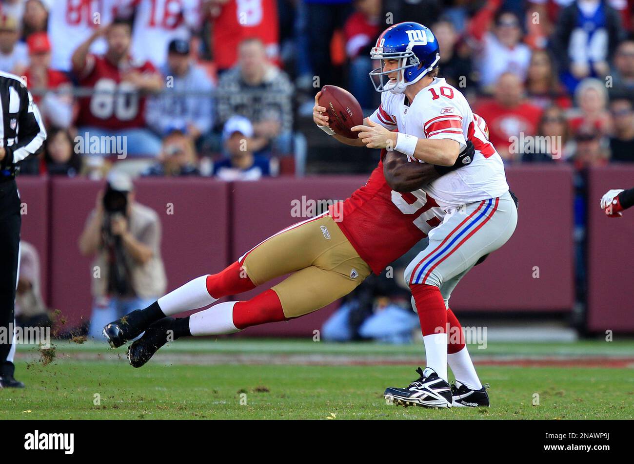 New York Giants quarterback Eli Manning (10) is sacked by San Francisco