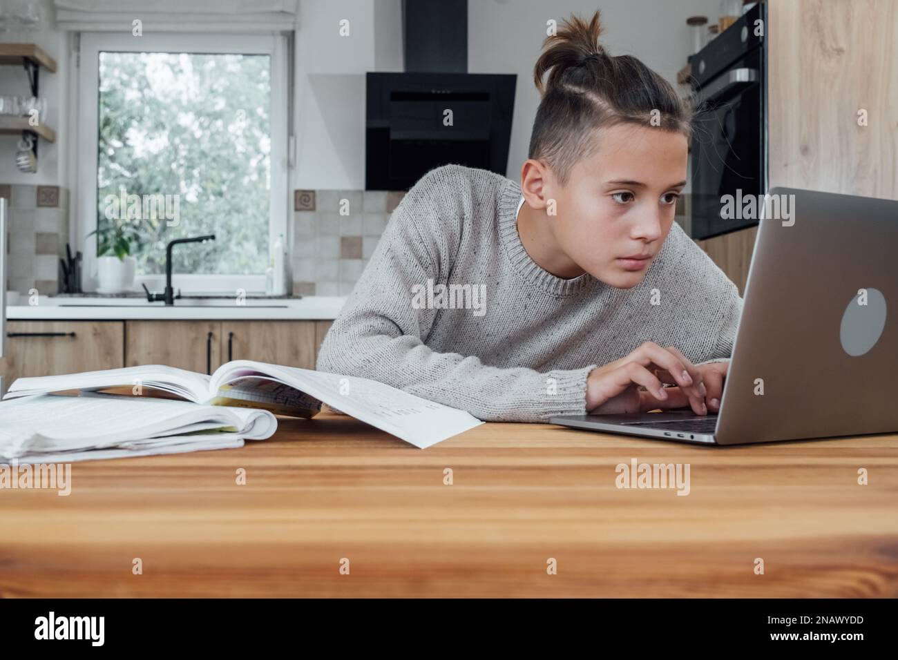 Teenage boy on laptop dark hi-res stock photography and images - Alamy